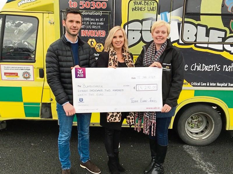 Paddy and Marisa Jones hand over €15k to Mary Heffernan, of Bumbleance