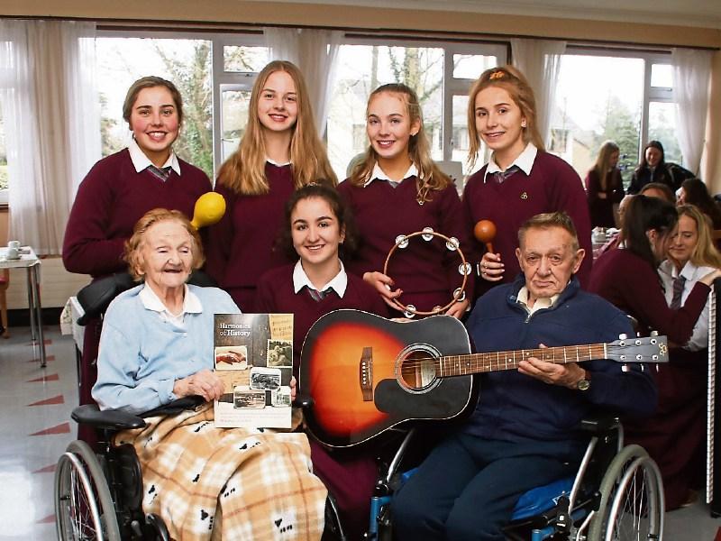 Elizabeth Blake and Harry Owens of St Paul's Nursing Home with Laurel Hill Coláiste students Sinead Cronin, Ellie Williamson, Sophie Kennedy, Hanna Hayes and Kate O'Reilly Picture: Adrian Butler