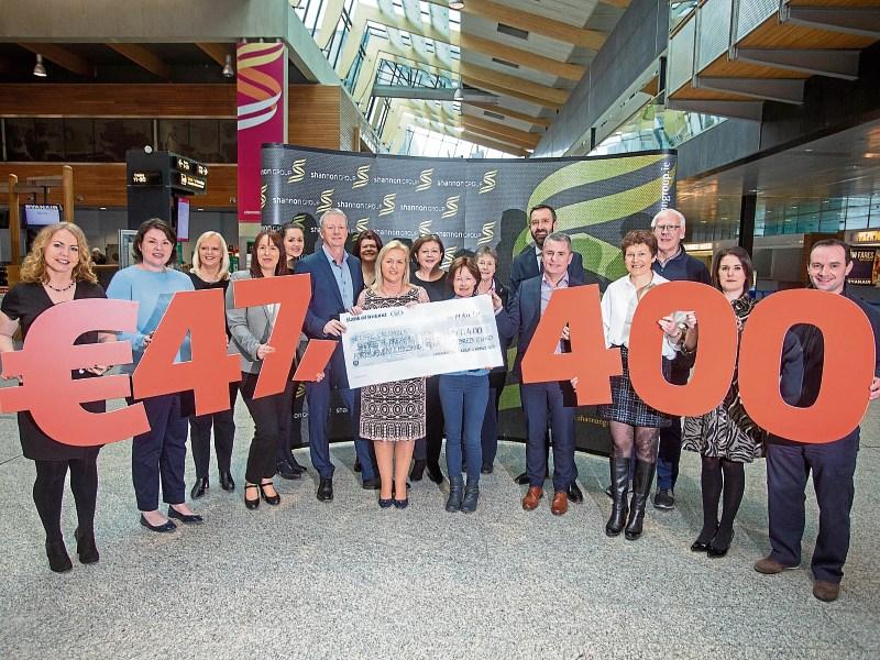 Shannon Group staff, pictured in the airport terminal, present Cllr Ann Norton, manager of Clare Crusaders, with a cheque following their fundraising exploits