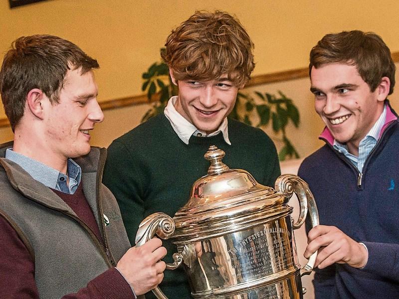 Jockeys Paul Townend, David Mullins and Jonathan Burke admire the Thyestes trophy