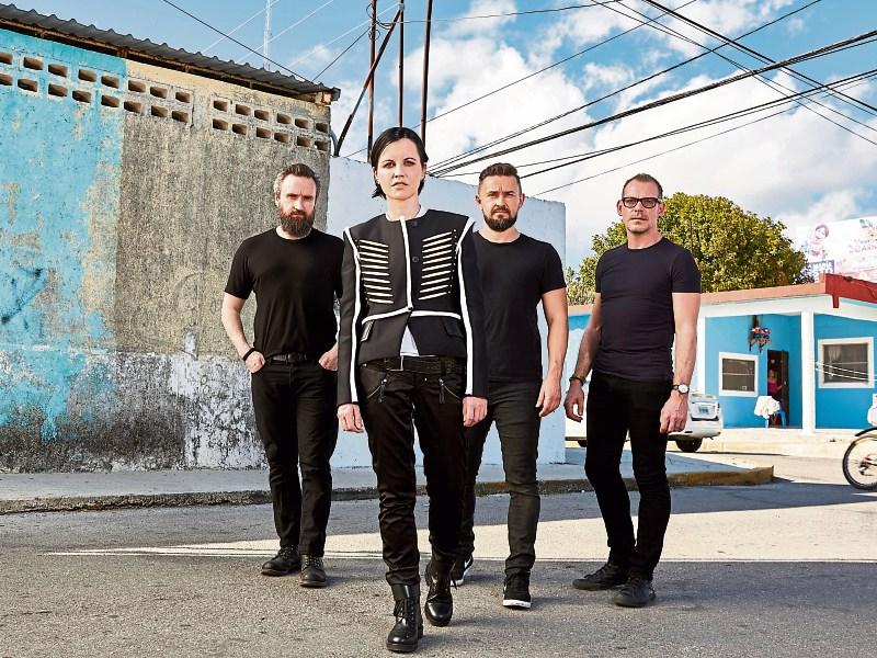 Noel Hogan, Mike Hogan and Fergal Lawler have paid tribute to lead singer Dolores O'Riordan, who died this Monday