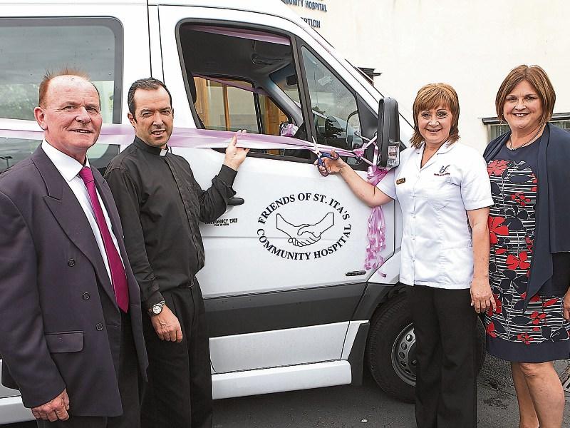 Driver Galina Permanicka cut the ribbon watched by John Collins, Fr John Mockler and Ann McMorrow Picture: Dave Gaynor
