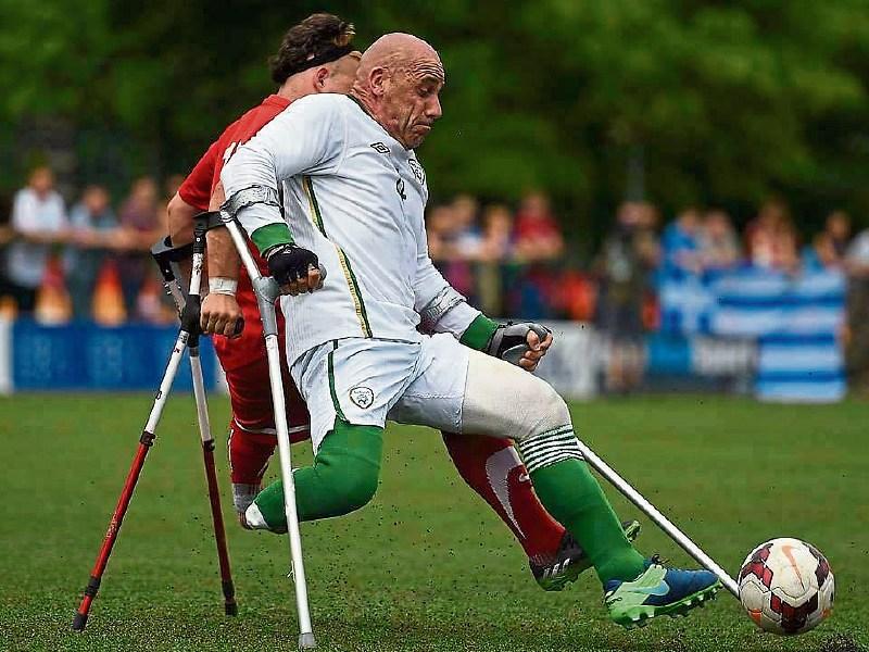Adare man Simon Baker in action on the senior international Irish amputee football team. The squad heads to Turkey this week