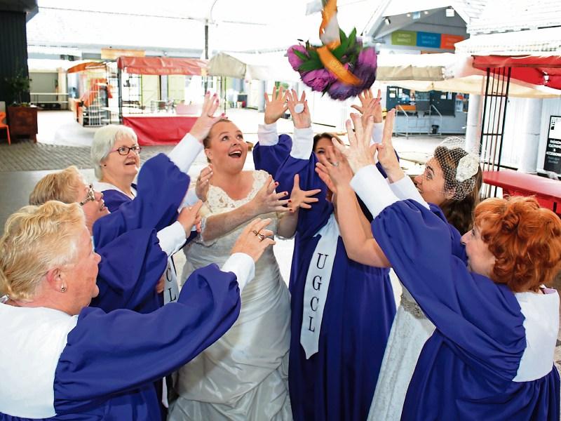 All eyes on the bouquet: Members of Unity Gospel Choir launch the event at the Milk Market Picture: Michael Cowhey