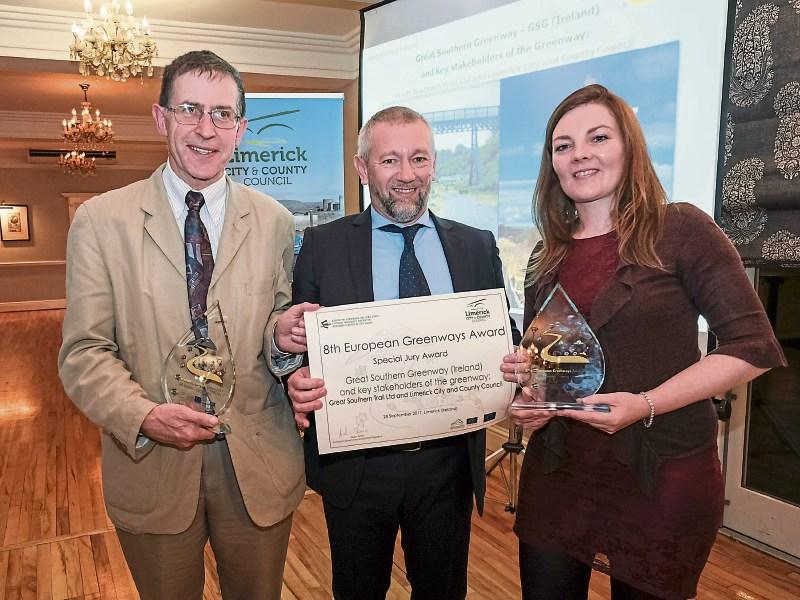 Liam O’Mahony of the Great Southern Trail Group and Majella O’Brien, Limerick City and County Council, accepting the special jury award from President of the European Greenway Association, Giulio Sene