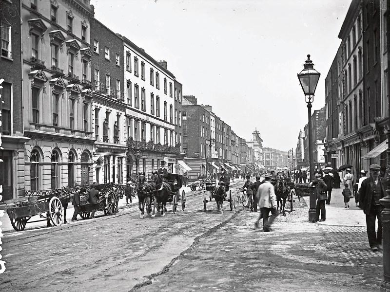 Limerick’s George Street – which later became O’Connell Street – pictured sometime after 1888. The roads on the busy thoroughfare were mere dirt tracks  Pictures from the book courtesy of Sean Curtin