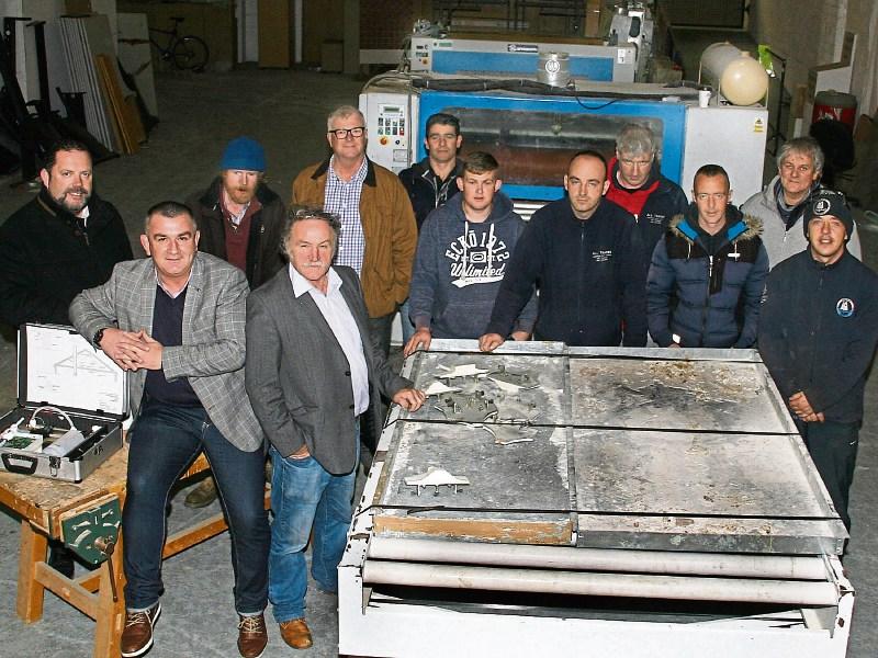 Ray O'Halloran with the new insulation manufacturing machines in Limerick City Build’s warehouse at the Cathal May Roberts building