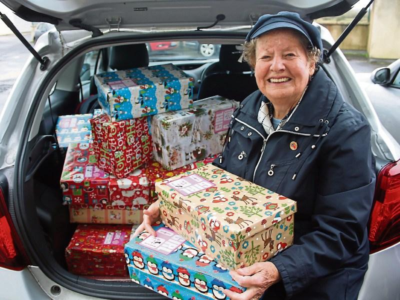 A heart of gold: Sigi Murrihy arriving at the depot in Limerick with some of the 214 shoeboxes she filled herself this year Picture: Michael Cowhey