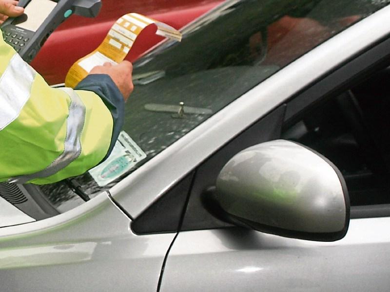 Gardai have been accused of carrying out a “quota filling” exercise by ticketing illegally parked cars during a funeral