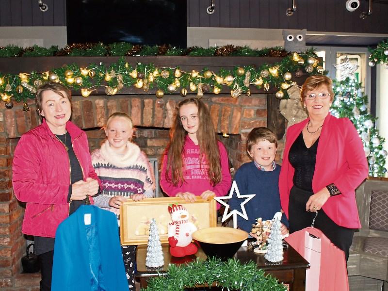 Getting ready for the Knockaderry Christmas Charity Craft Fayre are Helen Beckett, Niamh and Aine Sexton, Ciaran O'Mahony and Betty O'Sullivan