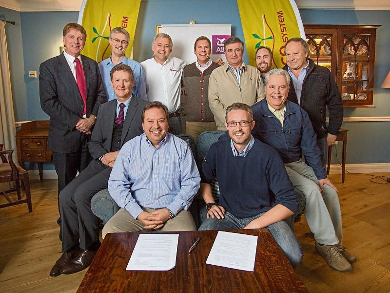 Luis Silva, Cooprinsem, and Matthew Shine, Samco, sign the €1.5m deal in the Dunraven Arms.