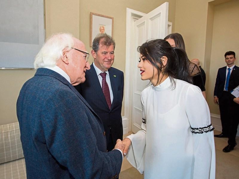 Scholarship recipient Leah Lyne meets President Higgins as JP McManus looks on Picture: Alan Place