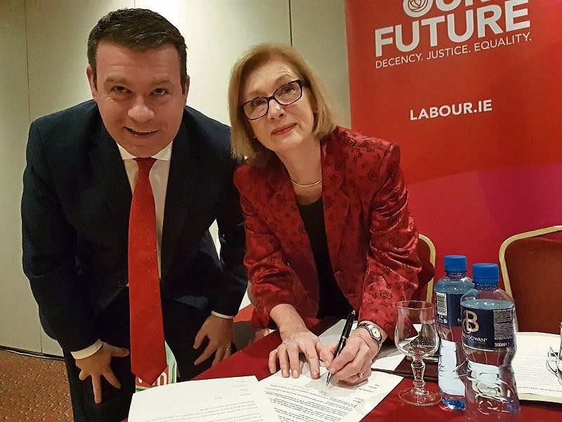 Former Education Minister Jan O’Sullivan, who will be fighting her ninth Dail election for Labour, pictured signing Labour’s party pledge with Tipperary TD Alan Kelly