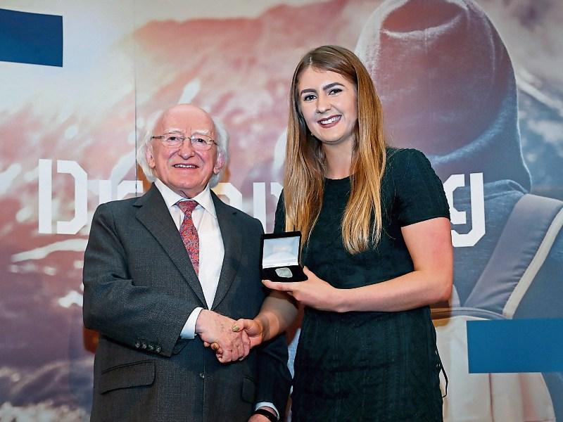 Aishling Kelleher, Ballinacurra, receives her Gold Gaisce Award from President Michael D Higgins