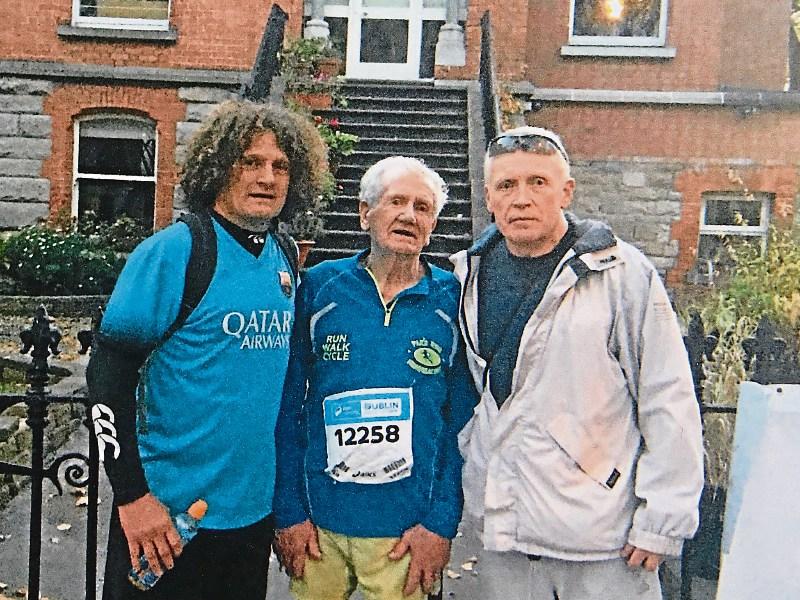Proud dad Phonsie Clifford, 87, with his athletic sons Richard and Denis on the day of Dublin City Marathon in October