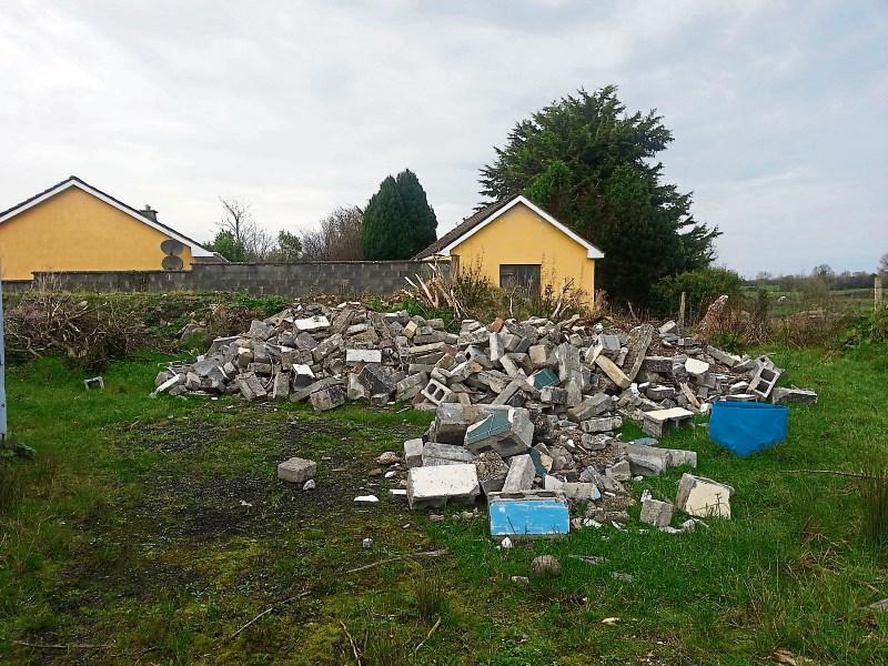 ‘Unsightly view’: The woman is living next door to a pile of rubble and a number of containers in East Bunratty, which according to the resident may even include the kitchen sink
