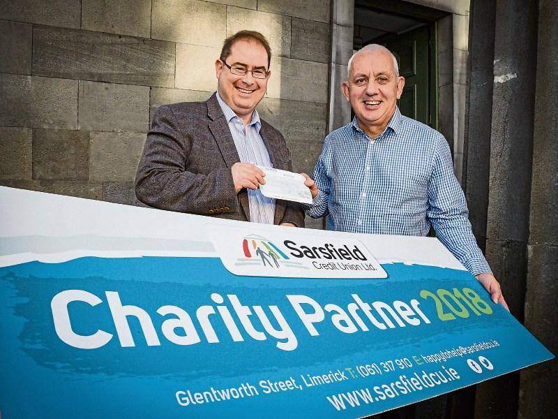 Patrick Flaherty, sales and marketing manager, Sarsfield Credit Union presents a cheque to Johnny Togher, Pieta House  Picture: Keith Wiseman