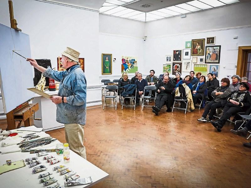 Artist John Shinnors giving a demonstration to members of Limerick Art Society at the City Art Gallery