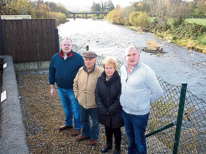 Paudie Twomey, Eamonn and Marie Roche, and Cllr Liam Galvin at the couple's home
