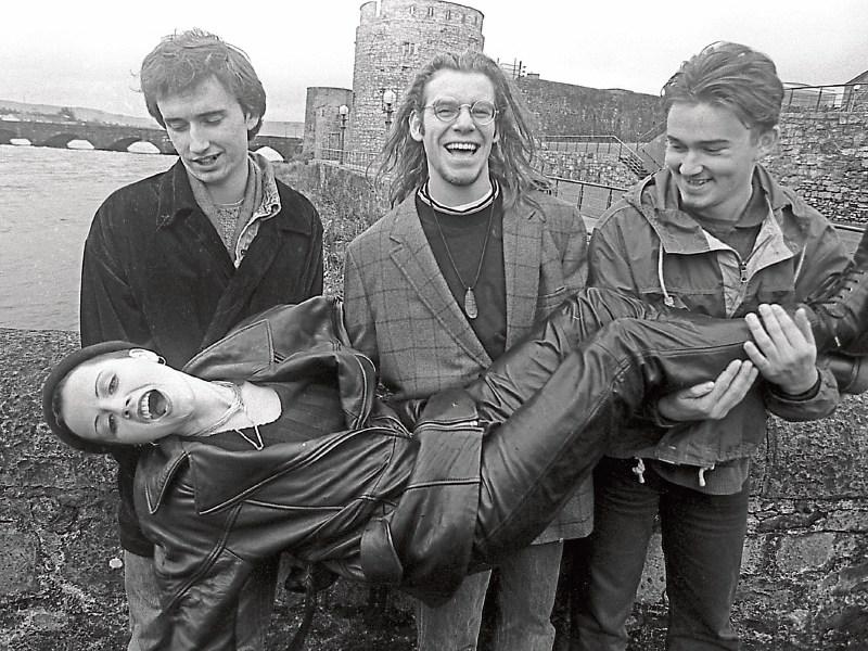 The late Dolores O’Riordan and her Cranberries bandmates having fun at a civic reception in the group’s honour in 1993. Below, with her mum Eileen and meeting Pope John Paul II