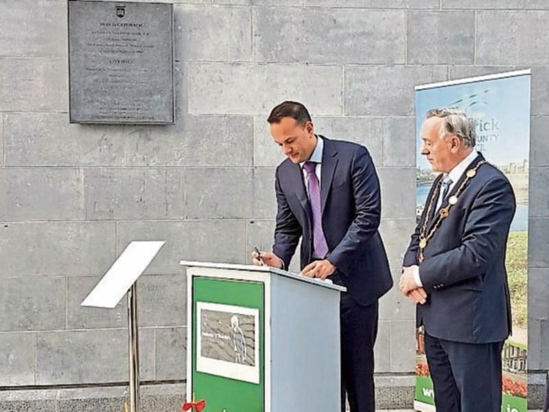 Taoiseach Leo Varadkar signing the book of condolence for Dolores O'Riordan at City Hall