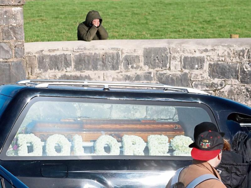 A lone mourner shows his grief as Dolores O'Riordan's funeral car passes Picture: Michael Cowhey