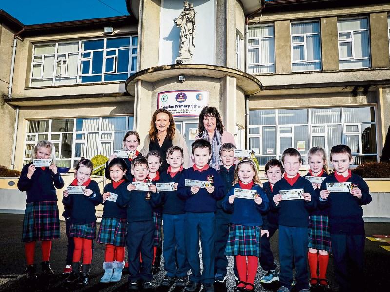 Celia Holman Lee and principal Deirdre Cusack with pupils of the Salesian Primary School Picture: Keith Wiseman