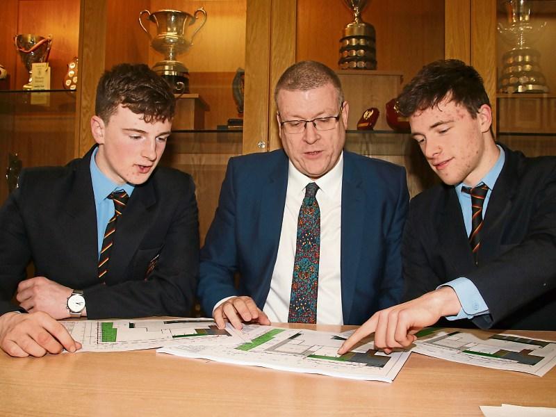 Ardscoil Rís principal Tom Prendergast looking over the plans with fifth year students Sean Long and Larlaith Cosgrove Pictures: Adrian Butler