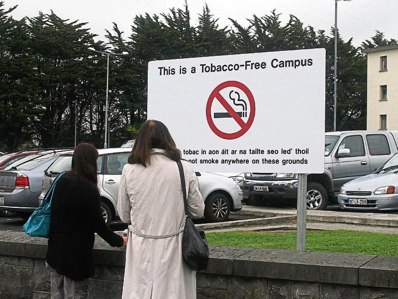 Smokers outside University Hospital Limerick, which outlawed smoking on the grounds in 2012 Picture: Michael Cowhey