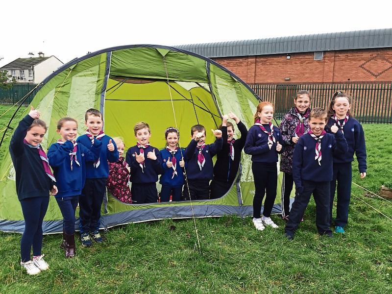Croom Scouts giving Vango the thumbs up, as they inspect one of their brand new tents donated by the company. Vango reps read the story of the theft on www.limerickleader.ie and got in touch to offer 