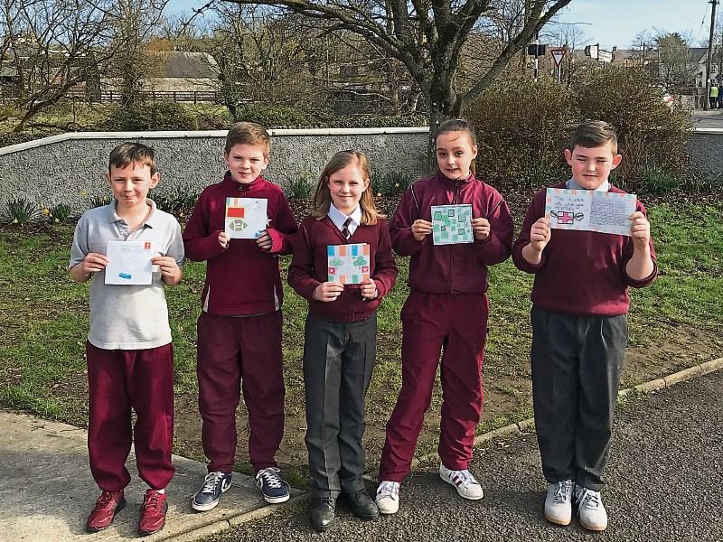 Students from Bruff NS with a sample of the many messages from abroad to be carried in the Bruff Parade