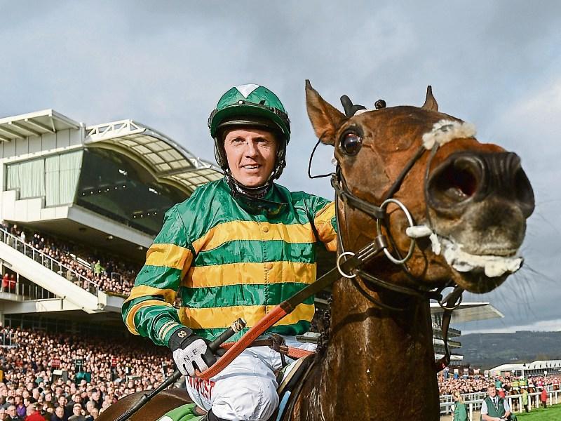 Noel Fehily and Buveur D’Air pictured after winning last year’s Champion Hurdle at Cheltenham. Owner JP McManus is hopeful of it retaining the title Picture: Sportsfile