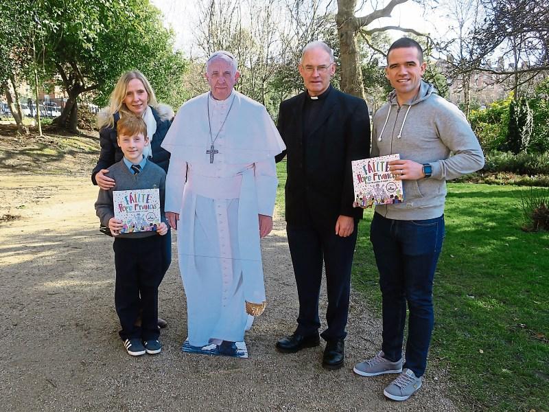 Fionn Roche; his mum Helen; a very lifelike cardboard cut out of Pope Francis; Br James L Dormer; Ger Brennan, former Dublin footballer, at Fionn’s prize giving ceremony