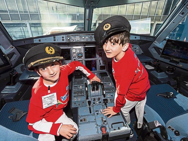 Ready for lift off: Hassan, left, and Hussein Benhaffaf, pictured in the cockpit of an Aer Lingus jet in Shannon Airport Picture: Diarmuid Greene/True Media