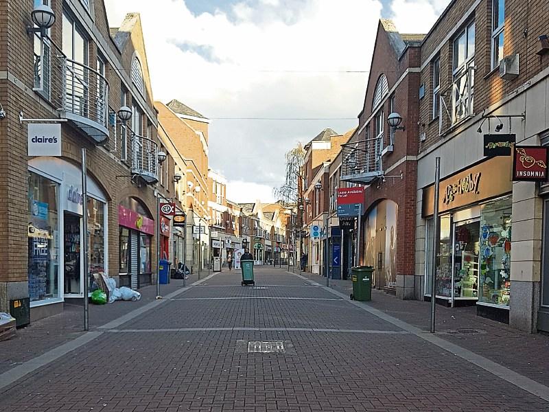 Late night shopping: Nigel’s pictures demonstrate the contrast between Cruise’s Street and the Crescent Shopping Centre, below, on Thursday around 7pm