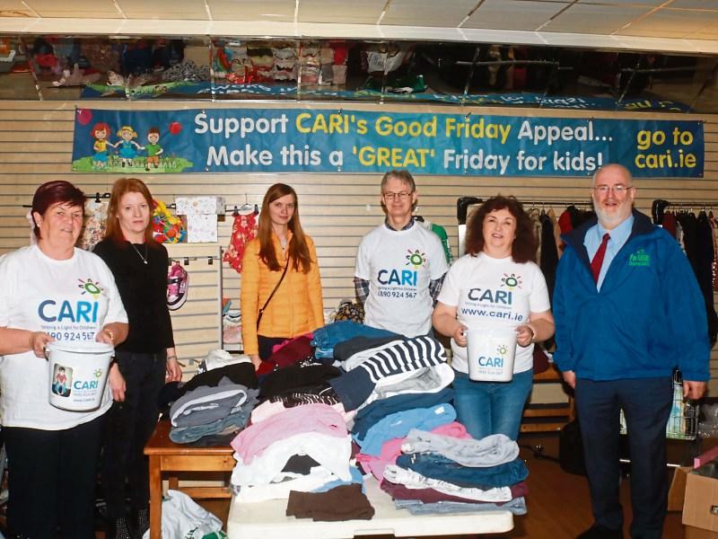 The CARI team at the Parkway shop, including centre manager Roger Beck Picture: Michael Cowhey