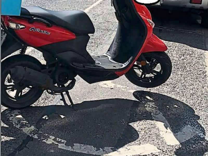 A fixed charge was issued to the moped after it parked across a disabled bay on O'Connell Street Picture: @GardaTraffic