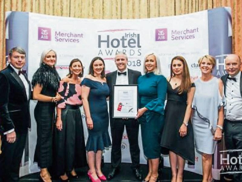 Celebration time: Staff at the George Boutique Hotel with the award
