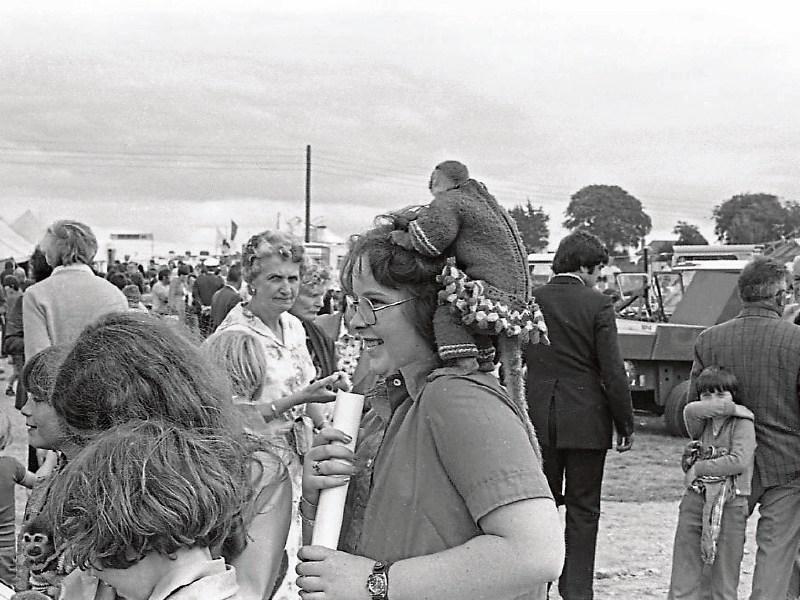 A girl with a monkey on her back at the Limerick Show in August 1978