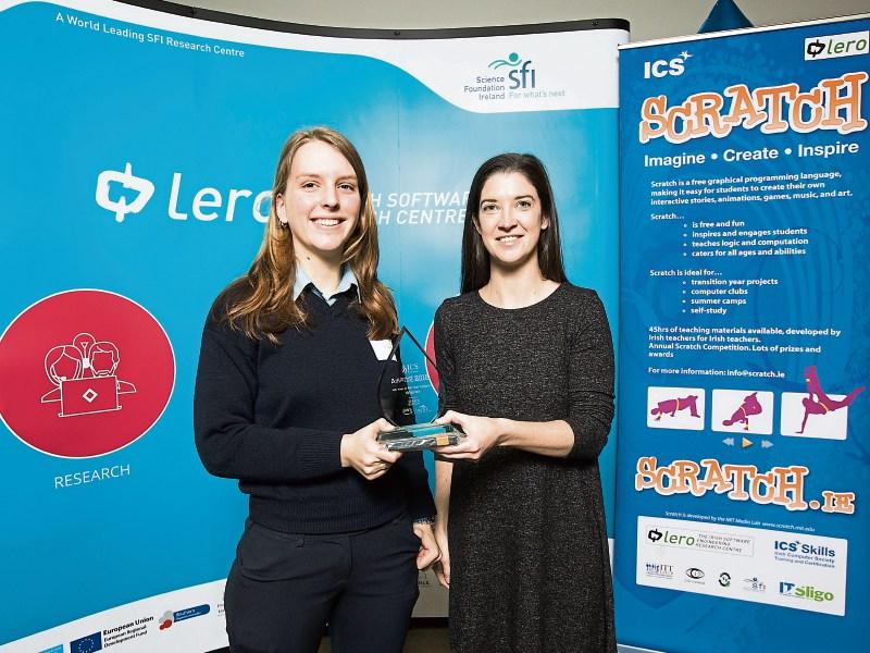 Dr Norah Patten, Space/STEM Communicator (right), presents fourth year to sixth year award to Dewi Goldenberg from Scoil Pól, Kilfinane for her project Clean up our Streets