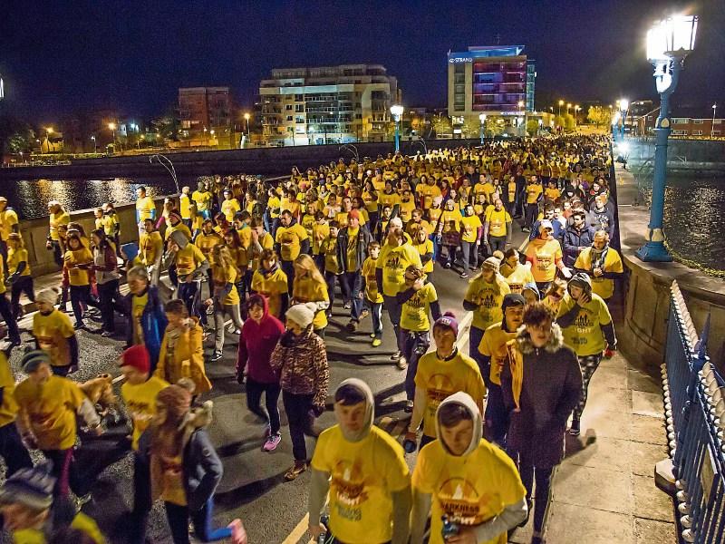 Thousands walking  in Limerick during a previous staging of the Darkness Into Light initiative