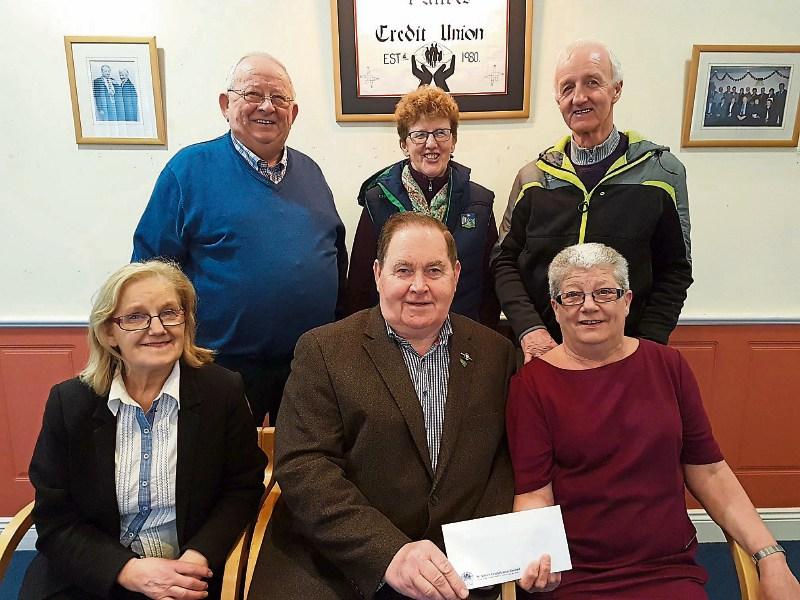 John McCarthy, Kilteely Tidy Towns, receives a sponsorship cheque from Esther Ryan, St Ailbe’s Credt Union, towards their anniversary party