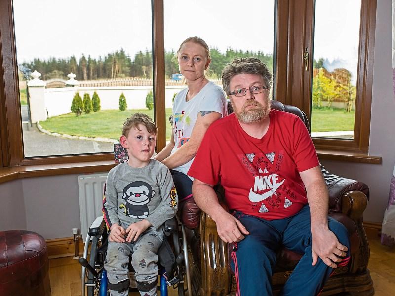 Richard and Caroline Enright, Athea, with their son Shane who has cerebral palsy and needs his home adapted picture: marie Keating