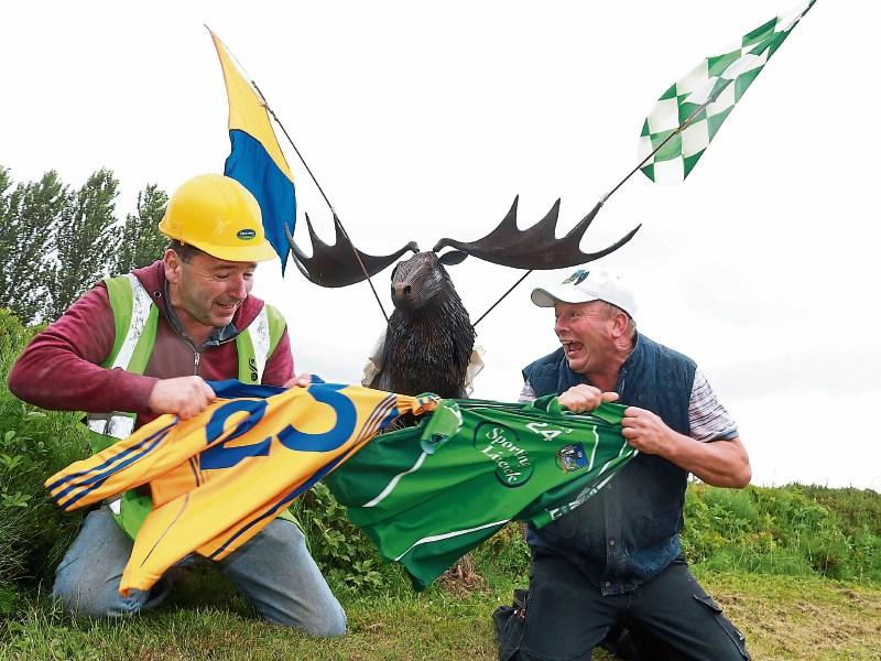 Tug of war: Pat Cullinan, Clarecastle, and Michael Casey, Limerick, father of Limerick hurlers Mike and Peter Casey, starting the battle early at the Coonagh Roundabout Picture: Michael Cowhey