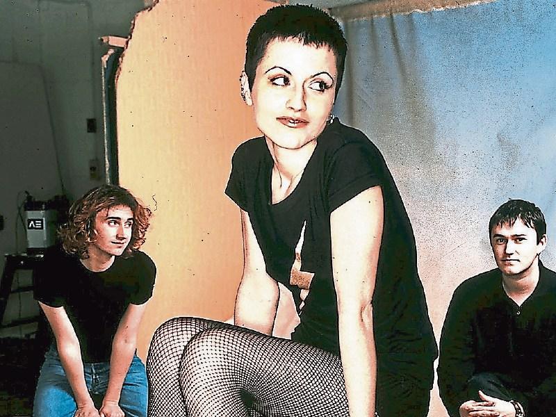 The late Dolores O’Riordan pictured in the early 1990s with bandmates Noel and Mike Hogan. A hometown tribute to the Cranberries frontwoman takes place in July Picture: O’Riordan Family