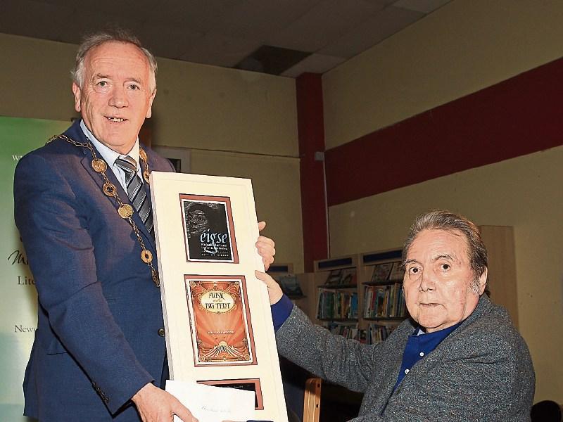 Macdara Woods accepting the Michael Hartnett Poetry Award from Mayor Stephen Keary this April 