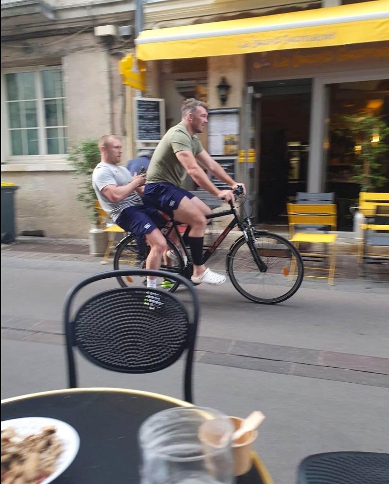 Munster rugby players spotted cruising down Parisian street on alternate transport 