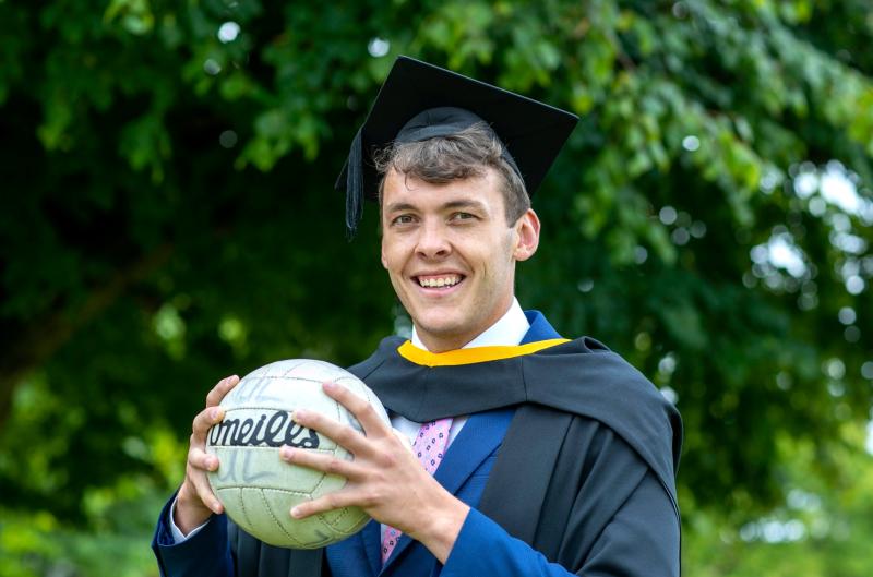 All-Ireland winning footballer David Clifford all smiles at UL graduation