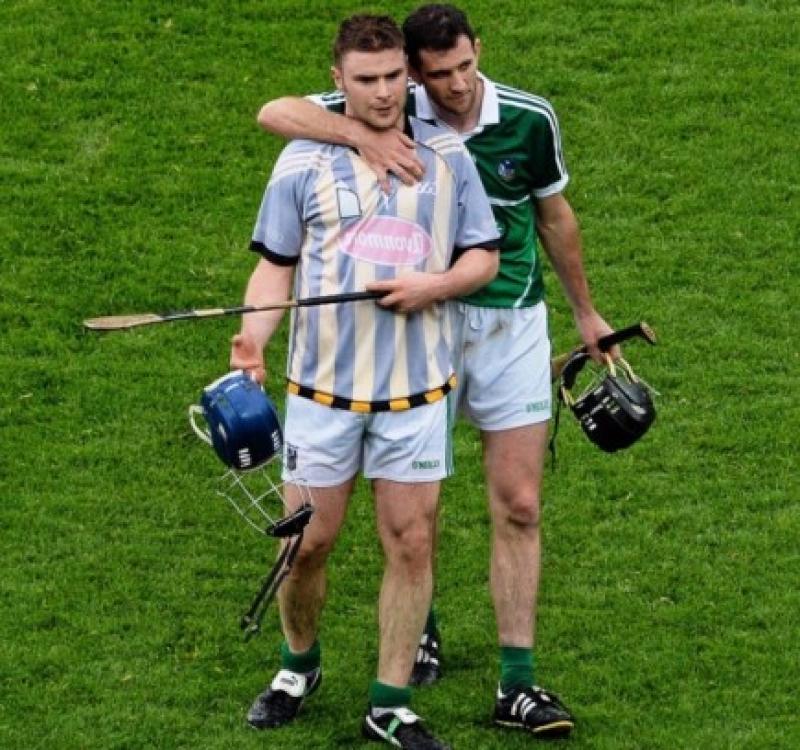 Dejected Limerick players, Richie McCarthy, left, and Donal O'Grady, leave the field after the loss to Kilkenny