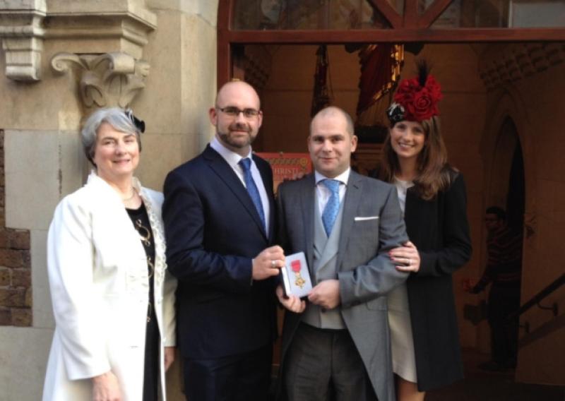 John Gilhooly with his brother Owen and mother Helen and sister Noreen, who are wearing Castleconnell milliner Aisling Mahers designs, at Johns OBE investiture ceremony in Buckingham Palace